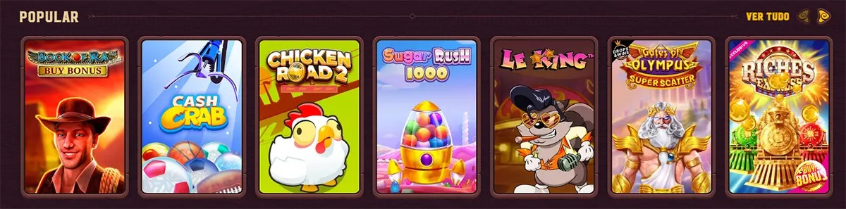 Popular online casino game carousel in Portuguese showing slot tiles for Book of Ra Buy Bonus, Cash Crab, Chicken Road 2, Sugar Rush 1000, Le King, Gates of Olympus Super Scatter, and Riches Express.
